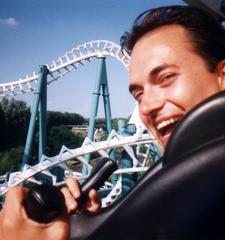 Photo of me with a rollercoaster in the background